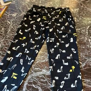 Moschino boutique, silk high heel design .black pants elastic on sides of waist